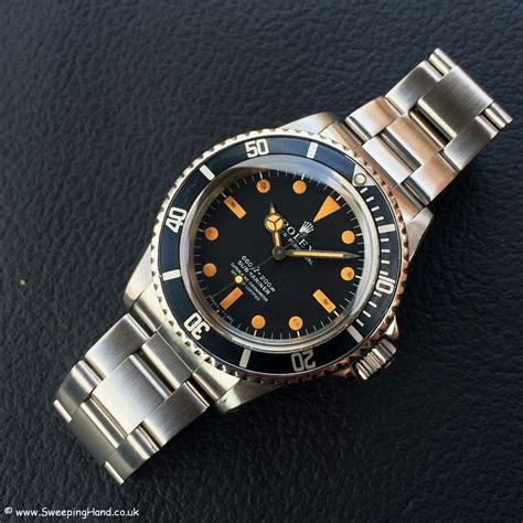 rolex submariner orange hand|Rolex Submariner.